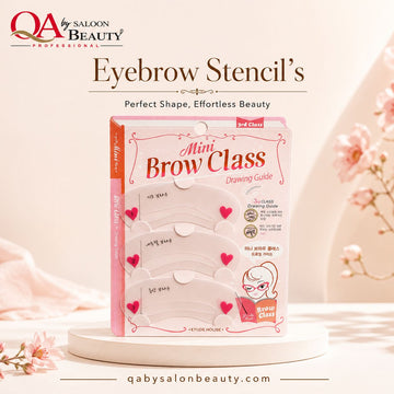 QA by Saloon Beauty Professional eyebrow stencil kit packaging labeled 'Mini Brow Class Drawing Guide' displayed on a white pedestal with decorative pink flowers and soft beige background.