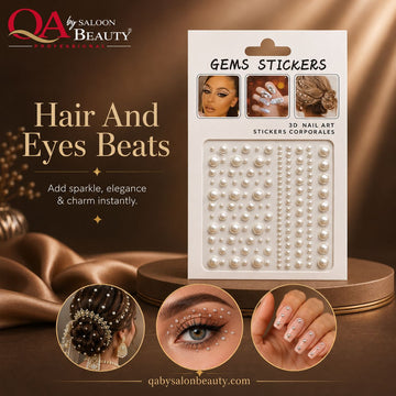 A package of pearl and white faux gem nail art stickers displayed on a gold-toned settable base with promotional text and before/after style close-ups of hair and eye embellishment. Branding for QA by Saloon Beauty is visible.