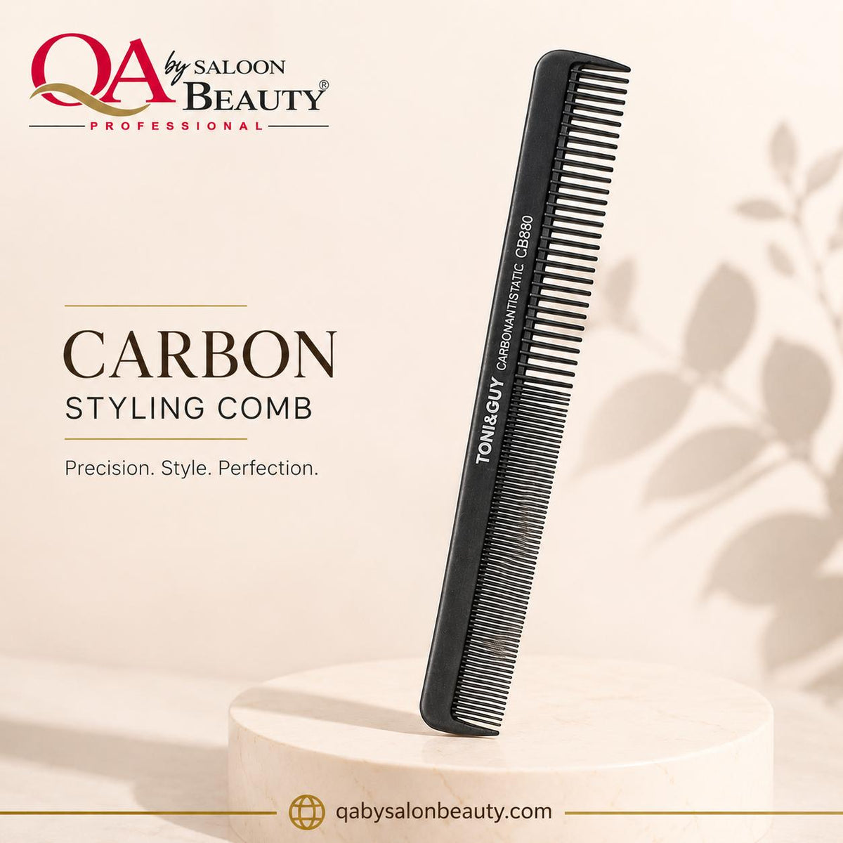 A black carbon styling comb by TONGUY stands upright on a round pedestal against a warm beige background with soft leaf shadows. The image includes the brand logo 'QA by Saloon Beauty' and text reading 'CARBON STYLING COMB' with 'Precision.